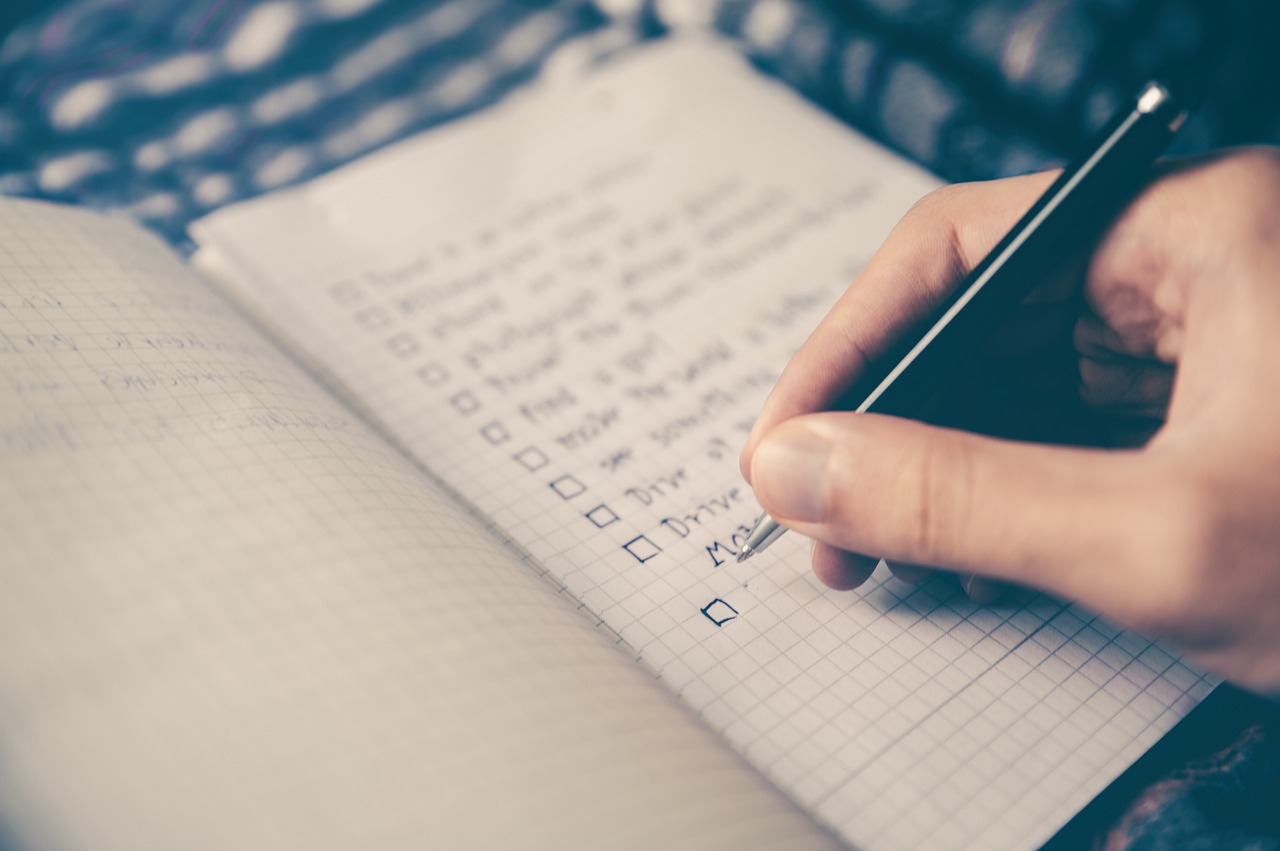 person making a goals checklist