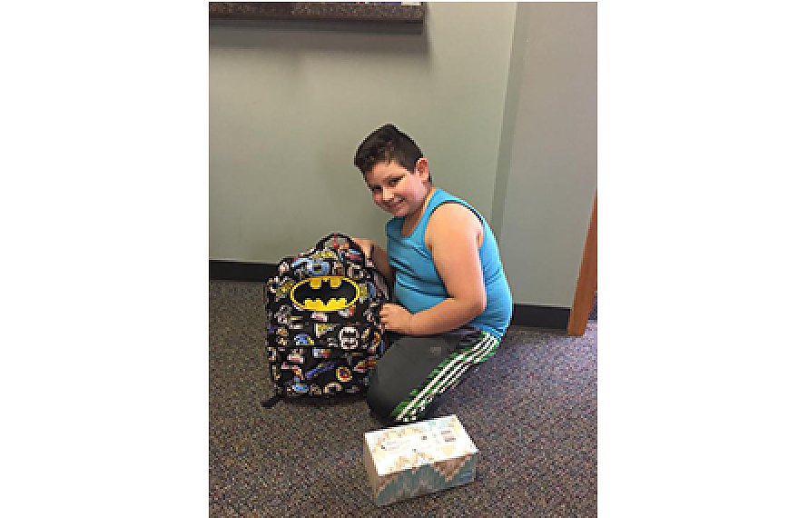Brian with his backpack at Comprehensive Rehab