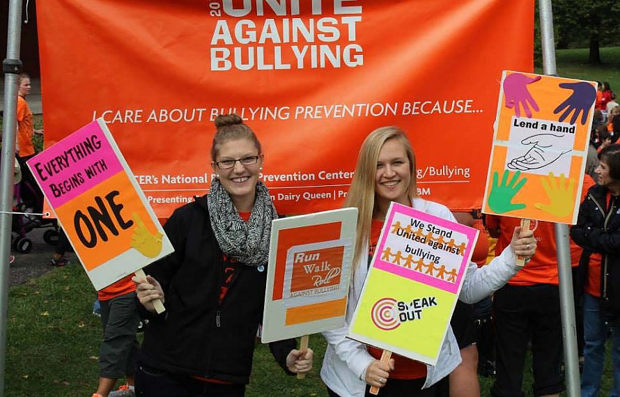 Unite Against Bullying - Ladies with Signs - Comprehensive Rehab