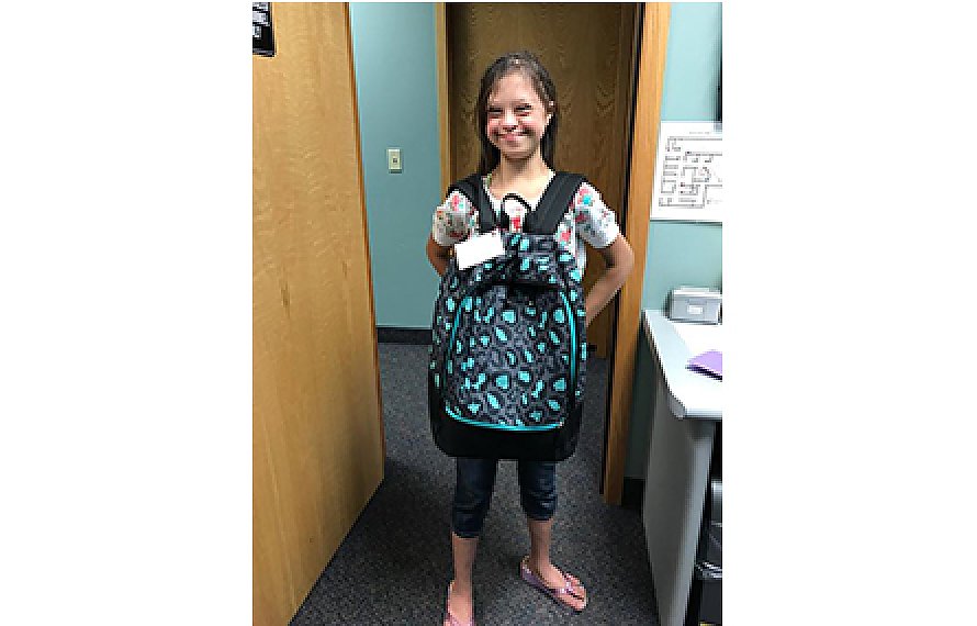 Happy Patient with backpack at Comprehensive Rehab