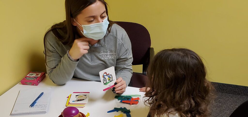 Speech Therapist works with child